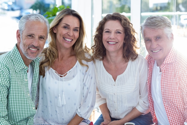 Happy mature couples in restaurant