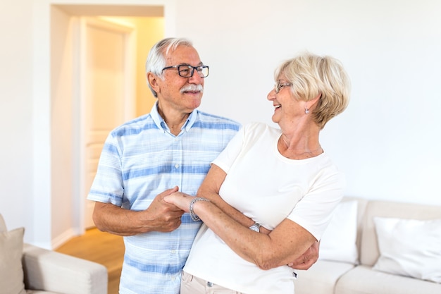 Happy mature loving couple dancing