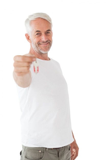 Happy mature man holding new house key