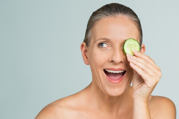 Happy mature woman skincare