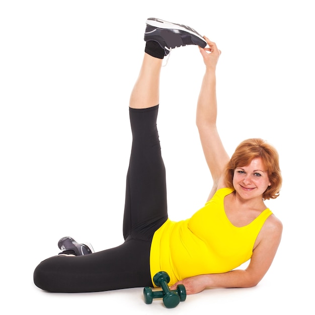 Happy middleaged woman exercising with dumbbells
