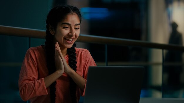 Happy middleeastern female work on computer confirmation celebrate triumph good business deal