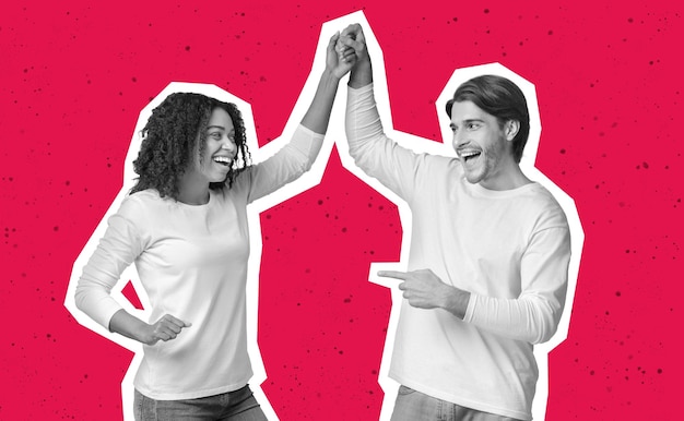 Happy mixed race couple celebrating success over colorful background