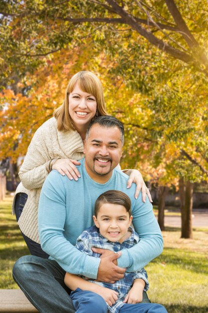 Happy Mixed Race Hispanic and Caucasian Family Portrait at the Park