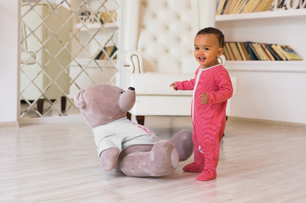 Happy Mixed Race Toddler Baby Boy indoors