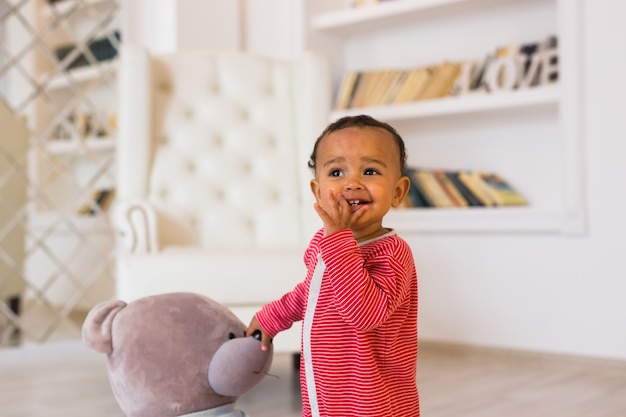 Happy Mixed Race Toddler Baby Boy indoors