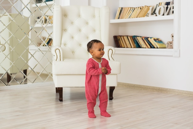 Happy Mixed Race Toddler Baby Boy indoors