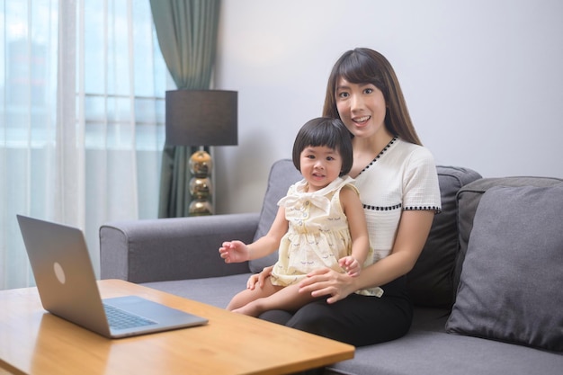 A happy mom and daughter relaxing at home