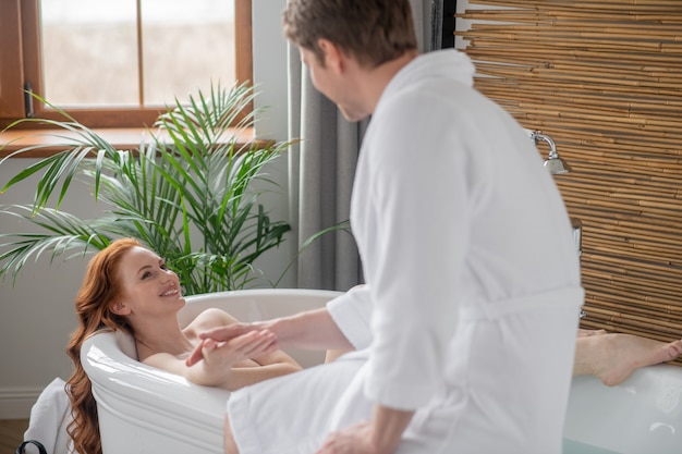 Happy moments. A couple in a bathroom looking contented and happy