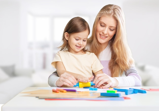 Happy Mother and daughter drawing