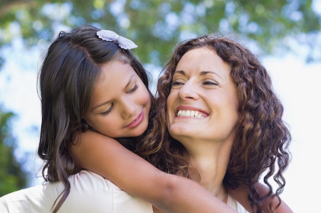 Happy mother and daughter embracing 