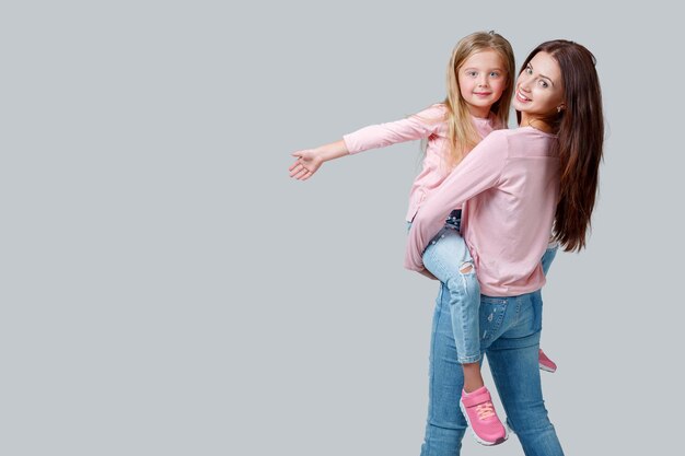 Happy mother and daughter having fun together