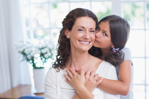 Happy mother and daughter hugging