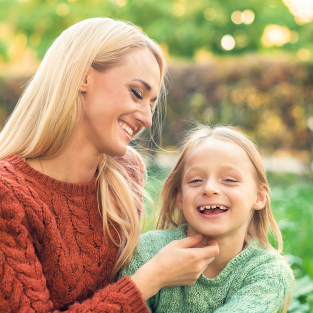 Happy mother and daughter in the park