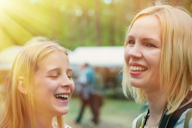 Happy mother Mom and daughter laugh together Toned