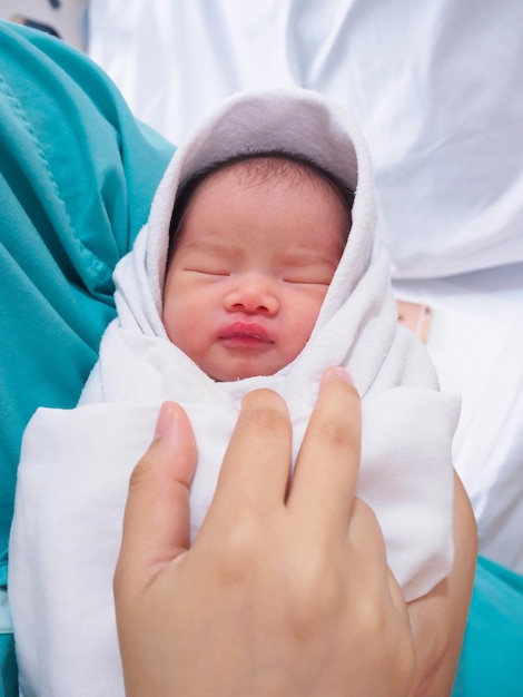 Happy mother and newborn baby at the hospital