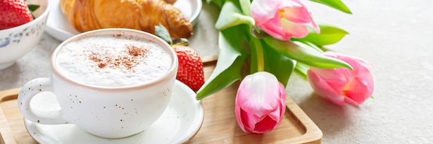 Happy mother's day beautiful breakfast lunch with cup of coffee cappuccino fresh croissants