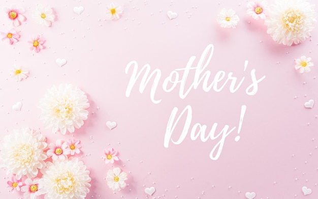 happy mother's day decoration concept made from flowers and the text on pink pastel background