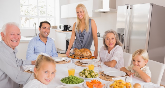 Happy mother serving a turkey