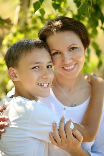 Happy mother with her son in park