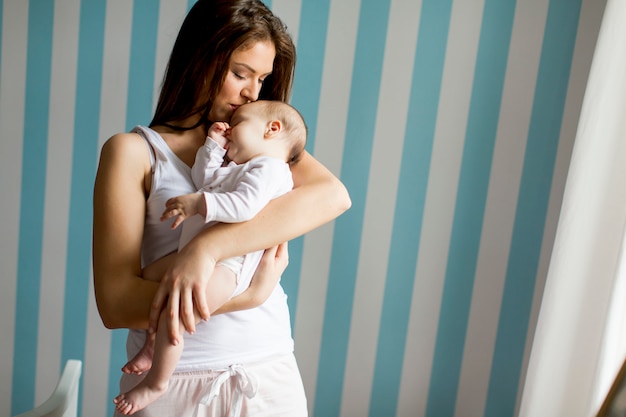 Happy mother with newborn baby girl