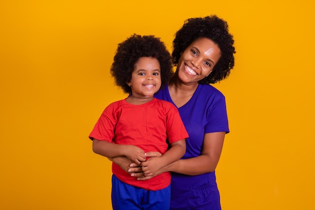 Happy Mothers Day Adorable and sweet young African American mother with a cute little daughter