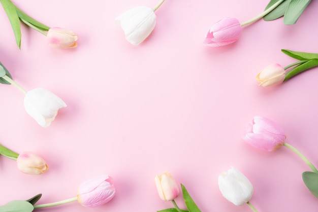 Happy mothers day concept. Top view of pink tulip flowers in frame