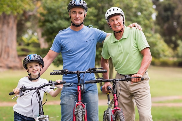 Happy multi generation family on their bike at the park 