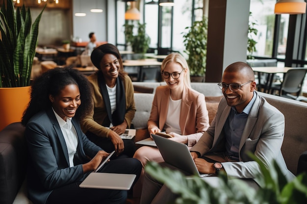 Happy multicultural business people smiling while sitting together in a coworking space