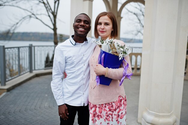 Happy multiethnic couple in love story.