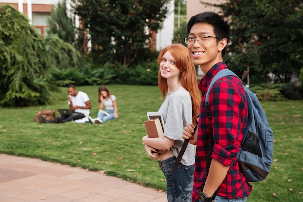 Happy multiethnic young couple walking together outdoors