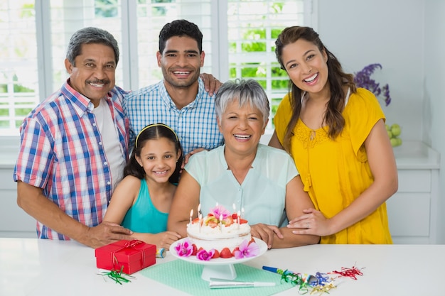 Happy multigeneration family celebrating birthday party at home