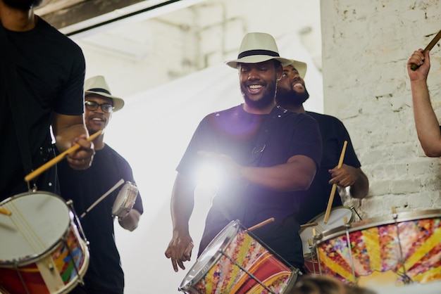 happy music and men at carnival with drums for festival cultural celebration and party event musician group concert and people with musical instrument for rhythm sound and tune for performance