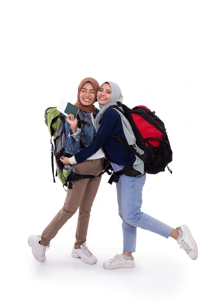 Happy muslim backpacker smiling isolated over white background