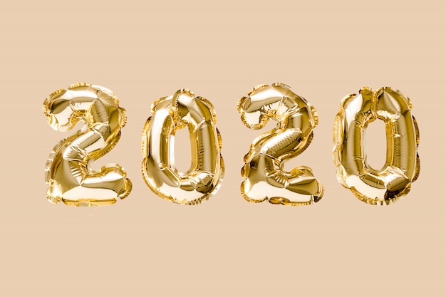 Happy New year 2020 celebration. Gold foil balloons numeral 2020 isolated 