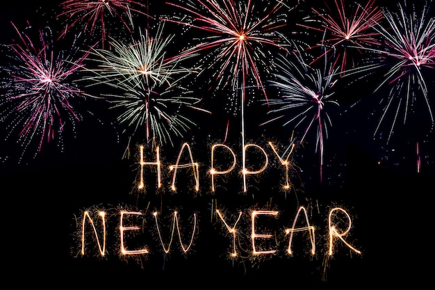 Happy New Year 2020. Creative text Happy New Year 2020 written sparkling sparklers isolated 