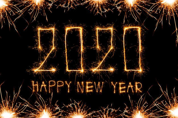 Happy New Year 2020. Creative text Happy New Year 2020 written sparkling sparklers