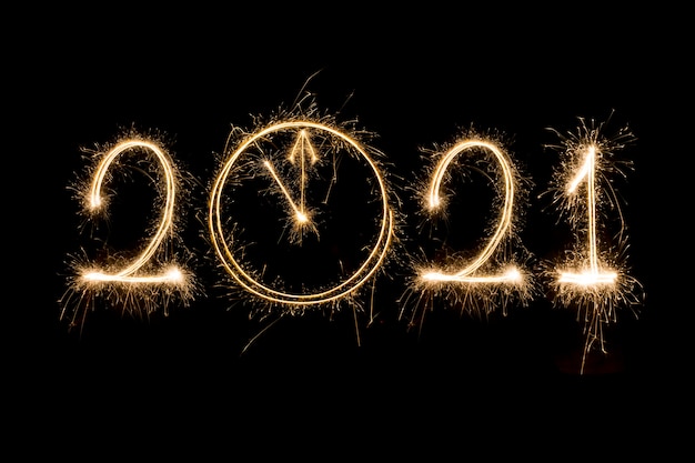 Happy New Year 2021. Sparkling burning text Happy New Year 2021 isolated on black.New year countdown