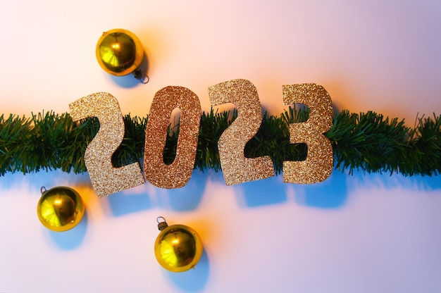 Photo happy new year 2023 golden numbers christmas white background