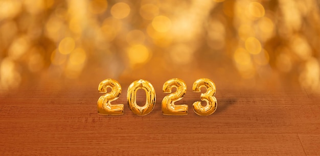 Felice anno nuovo 2023 numeri d'oro su uno sfondo lucido banner di capodanno