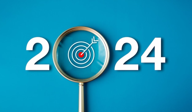 С Новым 2024 годом с баннером бизнес-концепции Большой белый номер 2024 года со значком Target внутри золотого увеличительного стекла на голубом фоне Планирование целей и концепций успеха