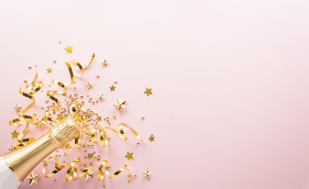 Happy New year celebration background concept Champagne bottle golden ribbon stars and christmas ball on pastel background