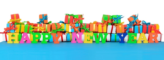 Photo happy new year colorful text on the background of varicolored gifts