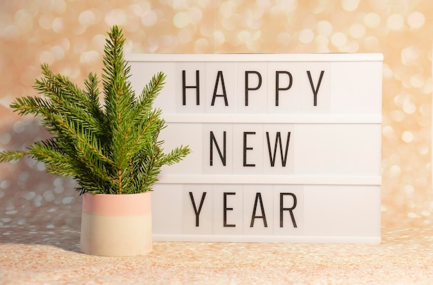 写真 新年あけましておめでとうございますエコ ツリー大晦日のコンセプト イメージとビンテージ ライト ボックスに表示されます。