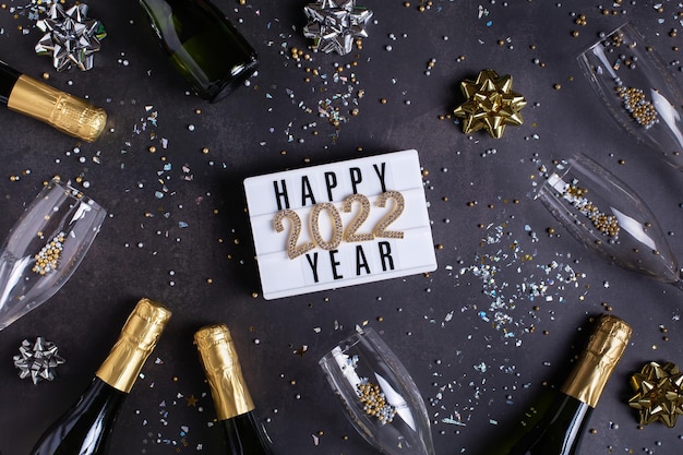 Happy new year greeting card  with champagne confetti