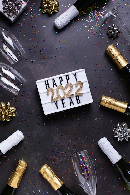 Happy new year greeting card  with champagne confetti