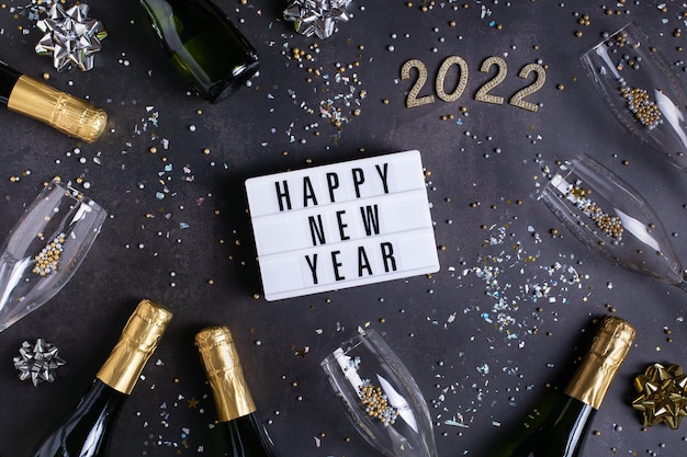 Happy new year greeting card  with champagne confetti