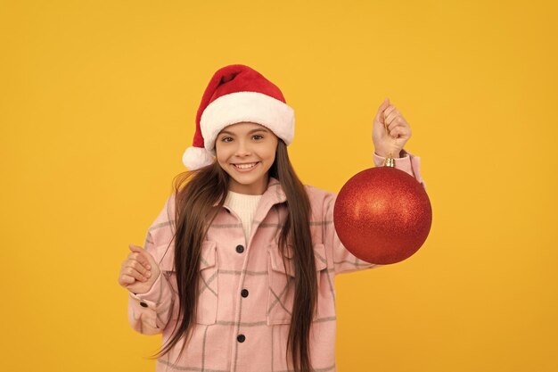 Happy new year merry christmas cheerful kid in santa claus hat teen girl