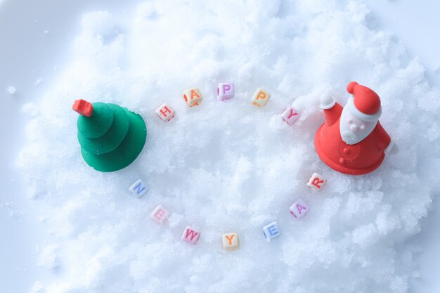 Happy New Year message made with letter cubes over snow