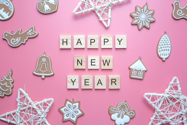 Photo happy new year text, on pink surface